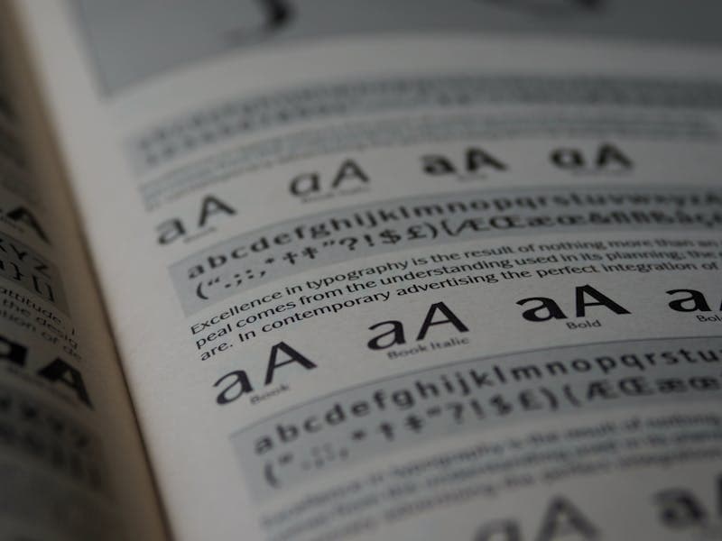 Designer adjusting text settings on screen
