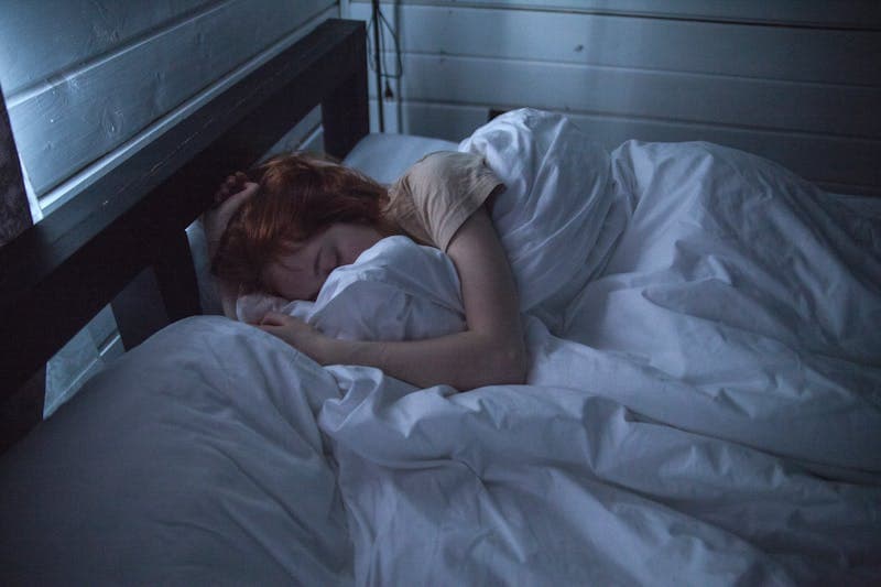 Person sleeping peacefully in comfortable bed