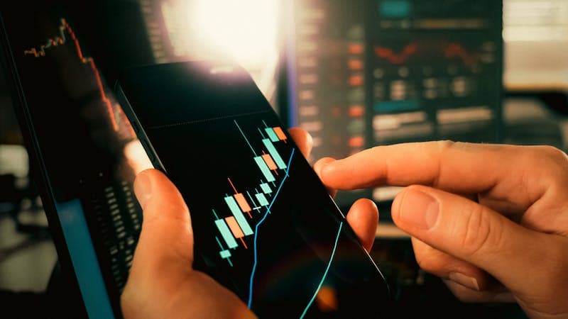 Stock market chart showing upward trend on monitor