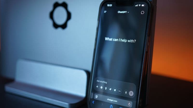 Close-up of a smartphone with AI chat interface, showcasing advanced technology in a sleek design