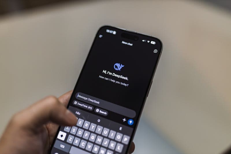 Person comparing search results on laptop and phone