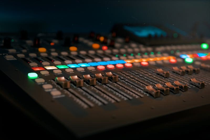 Person wearing headphones working on digital music production