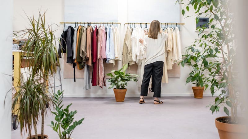 Organized wardrobe with color-coordinated clothing sections