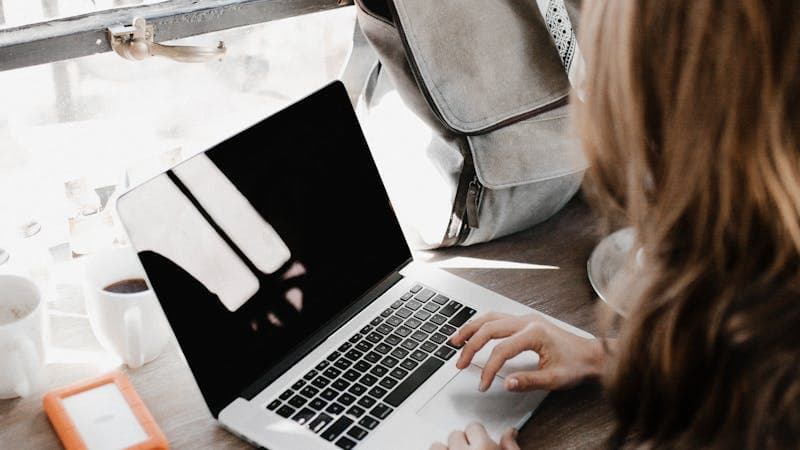 Content creator planning social media calendar on whiteboard