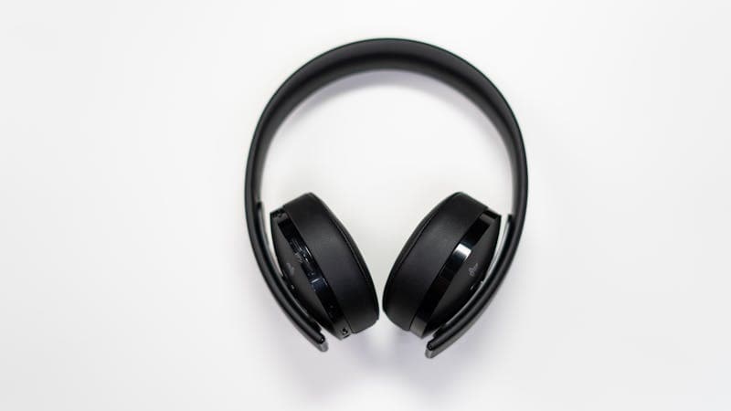 Person listening to AI-generated audio with headphones