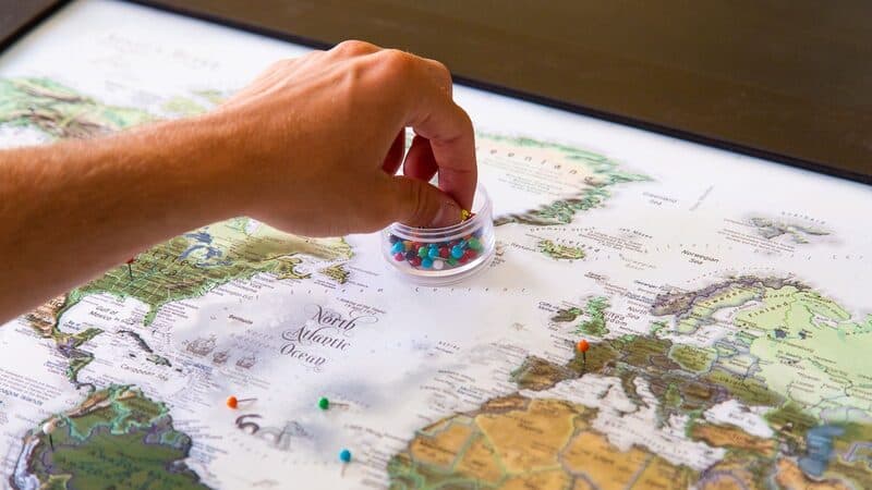 World map with travel itinerary pins