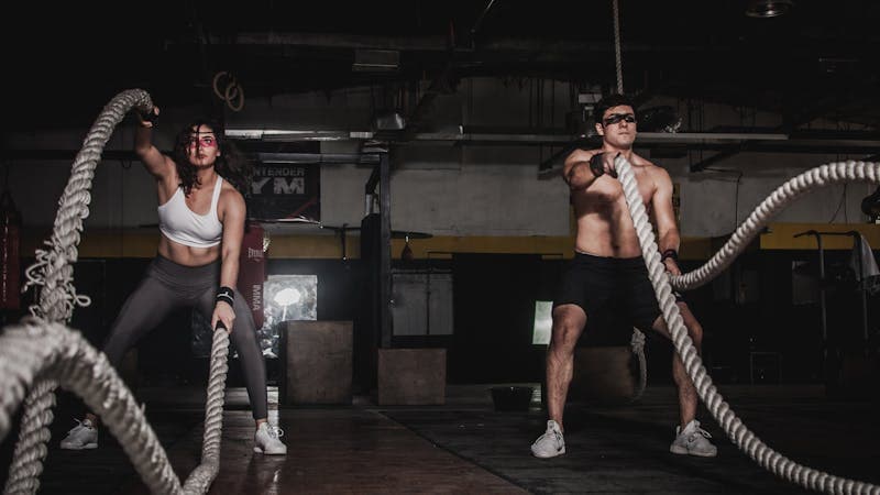 Person checking workout plan on phone at the gym
