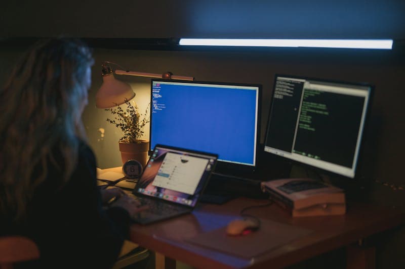 Binary digits and hexadecimal values on a dark screen