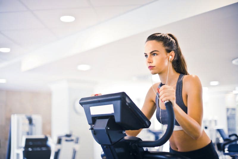 Person checking fitness tracking app on smartphone