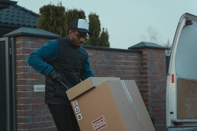 Warehouse worker scanning packages for shipment