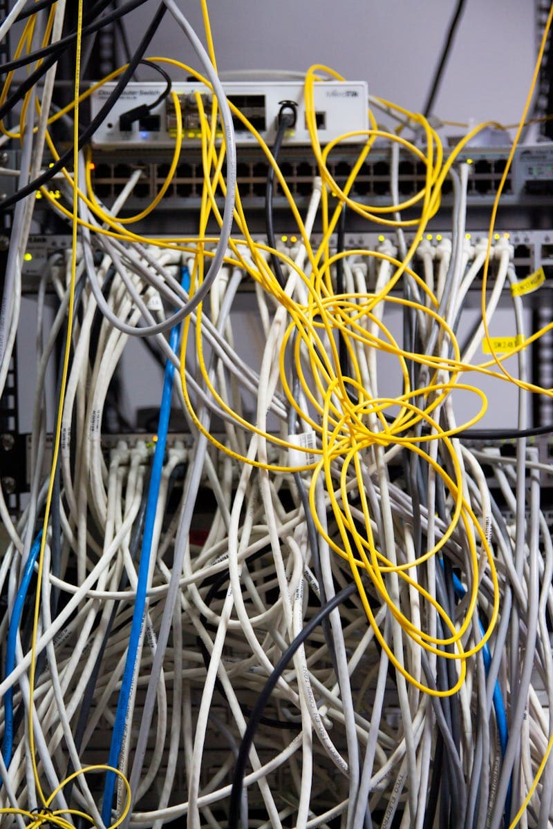 Server room with network cables and blinking lights
