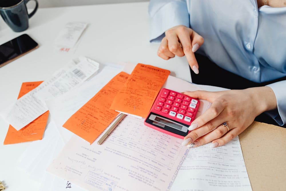 Professional invoice document on desk with laptop