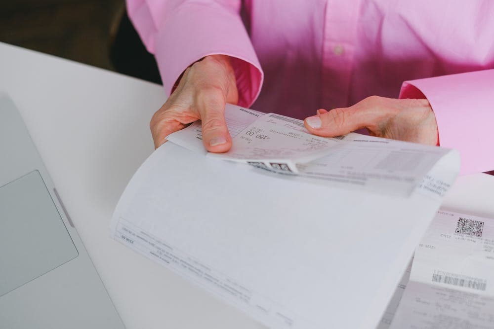 Freelancer reviewing invoice on tablet