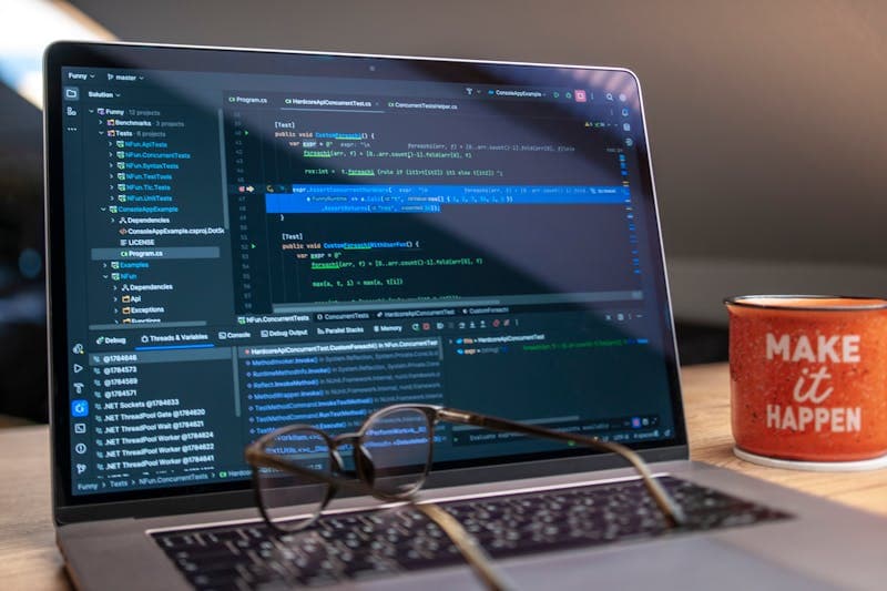 Developer team reviewing code together at a shared screen