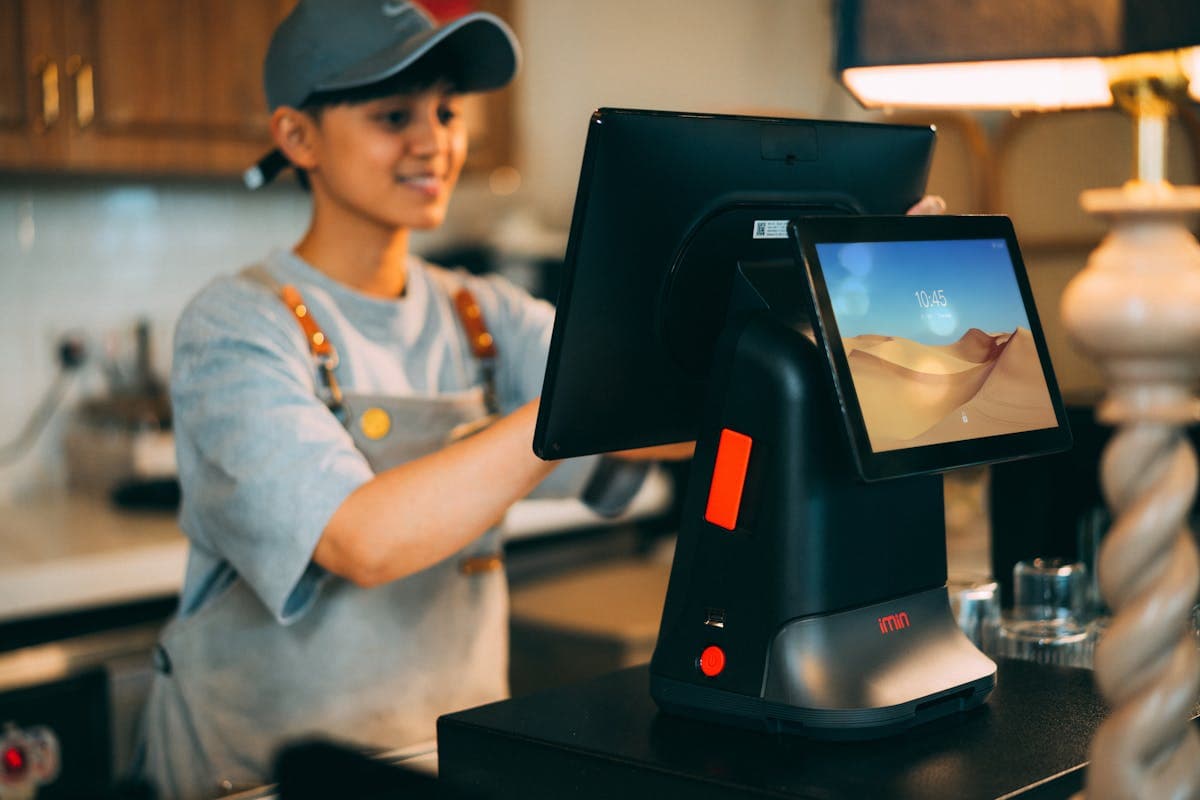 Small business owner organizing receipts at desk