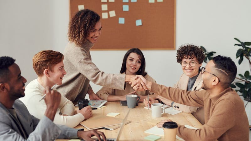 Professional meeting discussing freelance business contracts