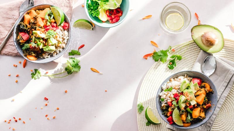 Healthy meal preparation with colorful vegetables and a timer