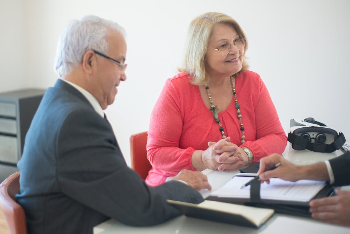 House keys on signed mortgage contract on table