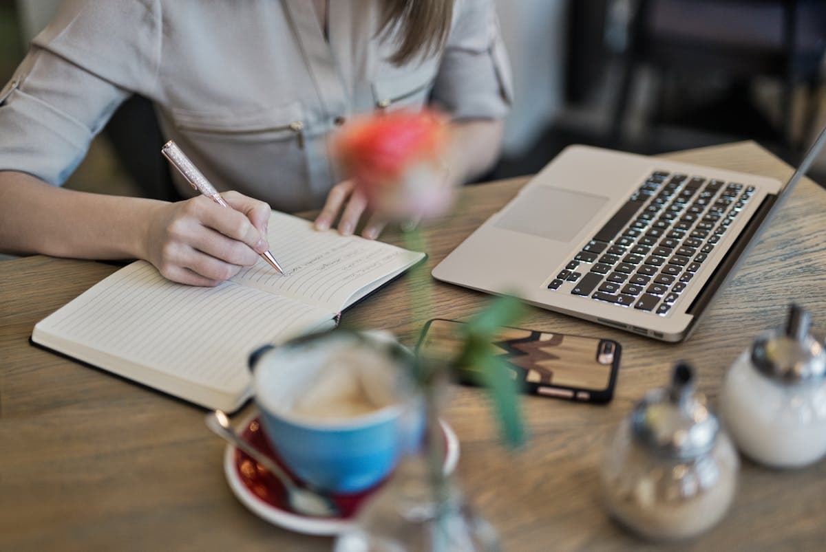 Content writer reviewing readability metrics on laptop