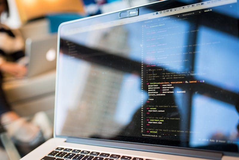 Developer reading API documentation on laptop
