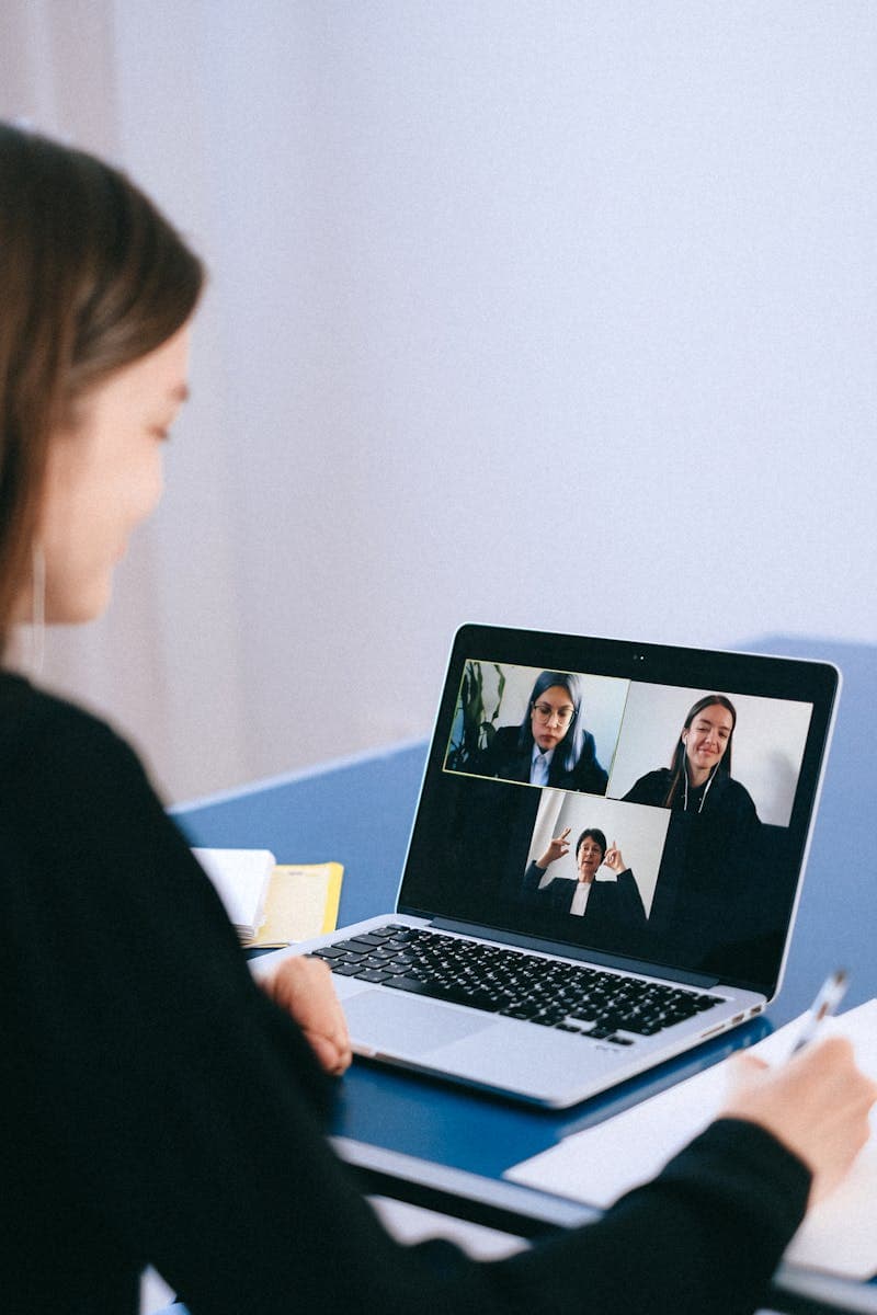 Remote worker on a video call with laptop at home
